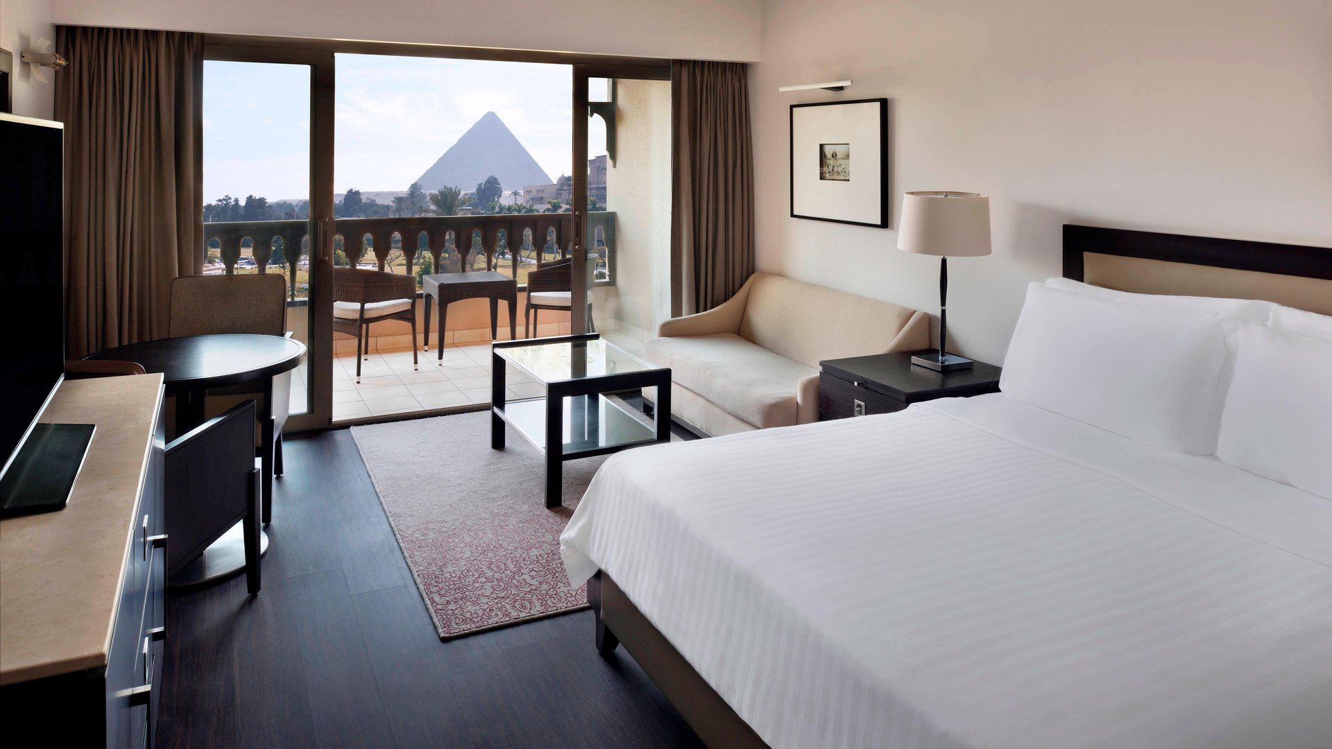 A Mena House room with its balcony framing the Great Pyramid