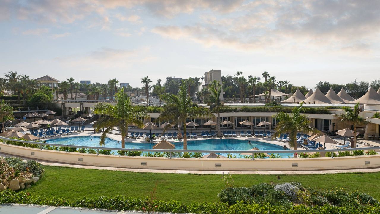 The gardens and pool of JW Marriott Hotel Cairo in New Cairo