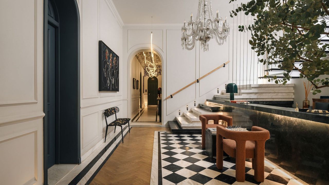 The marble-floored lobby of Mazeej Balad under a crystal chandelier