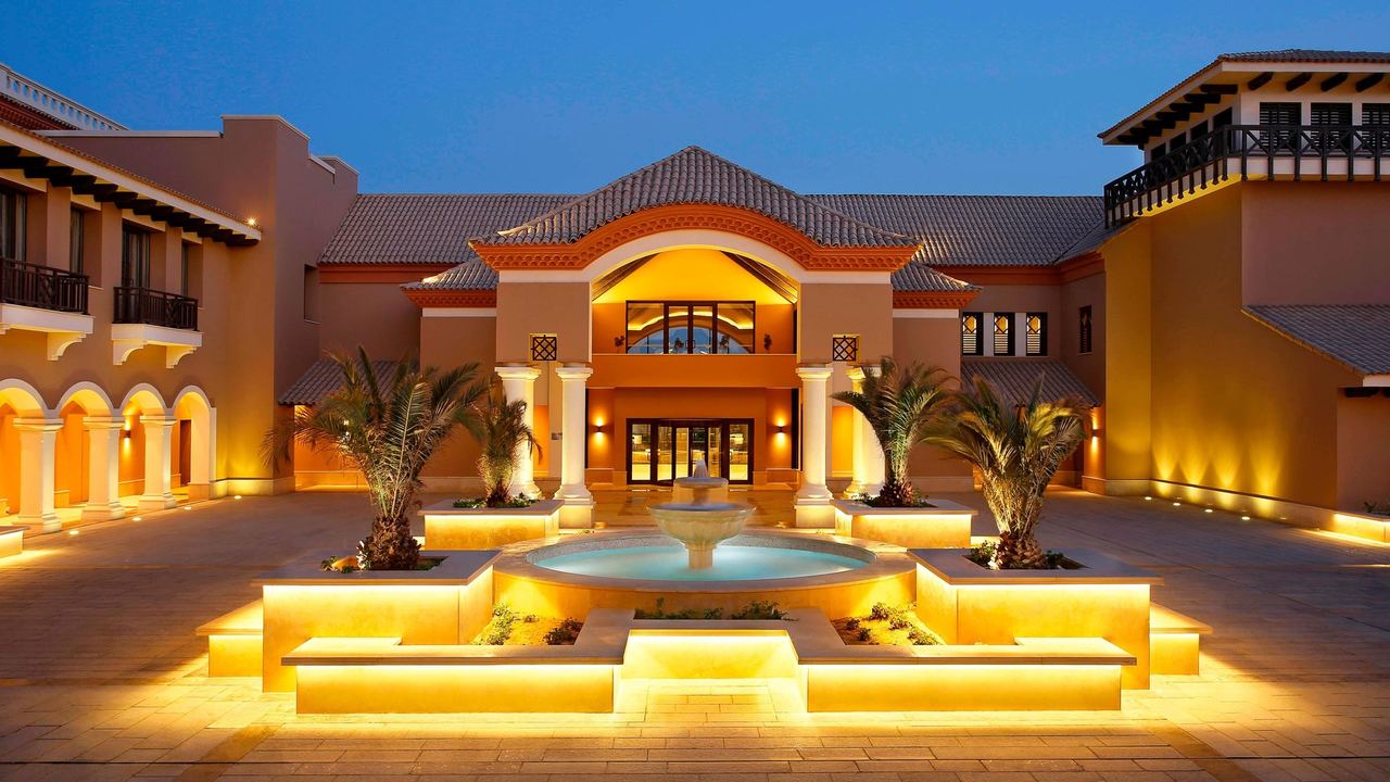 The fountain court of The Westin Cairo Golf Resort & Spa lit at dusk